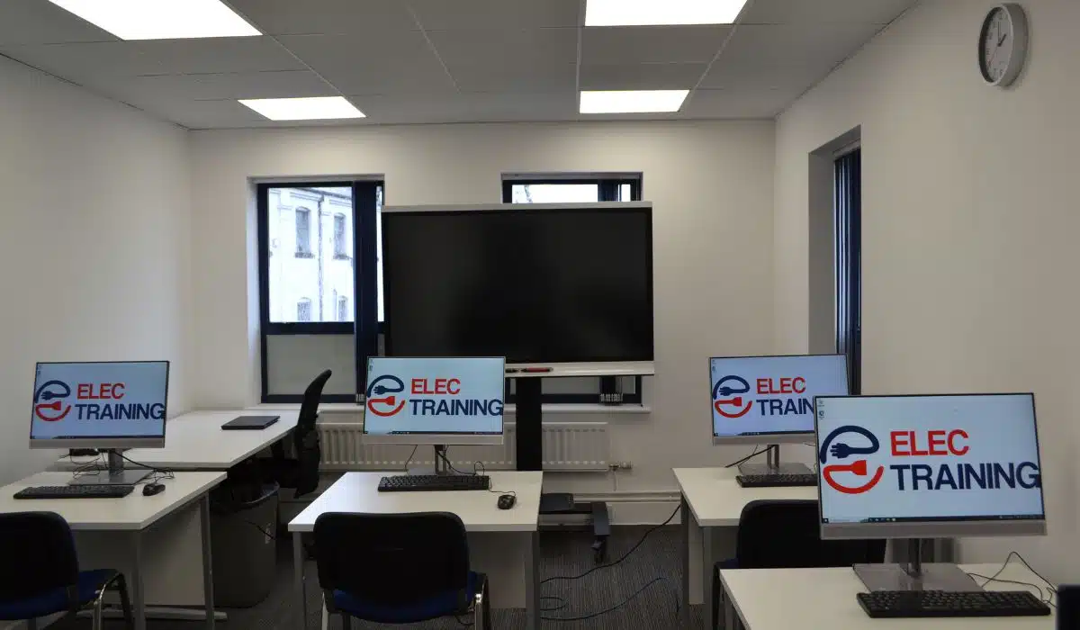 classroom with computers and smartboard
