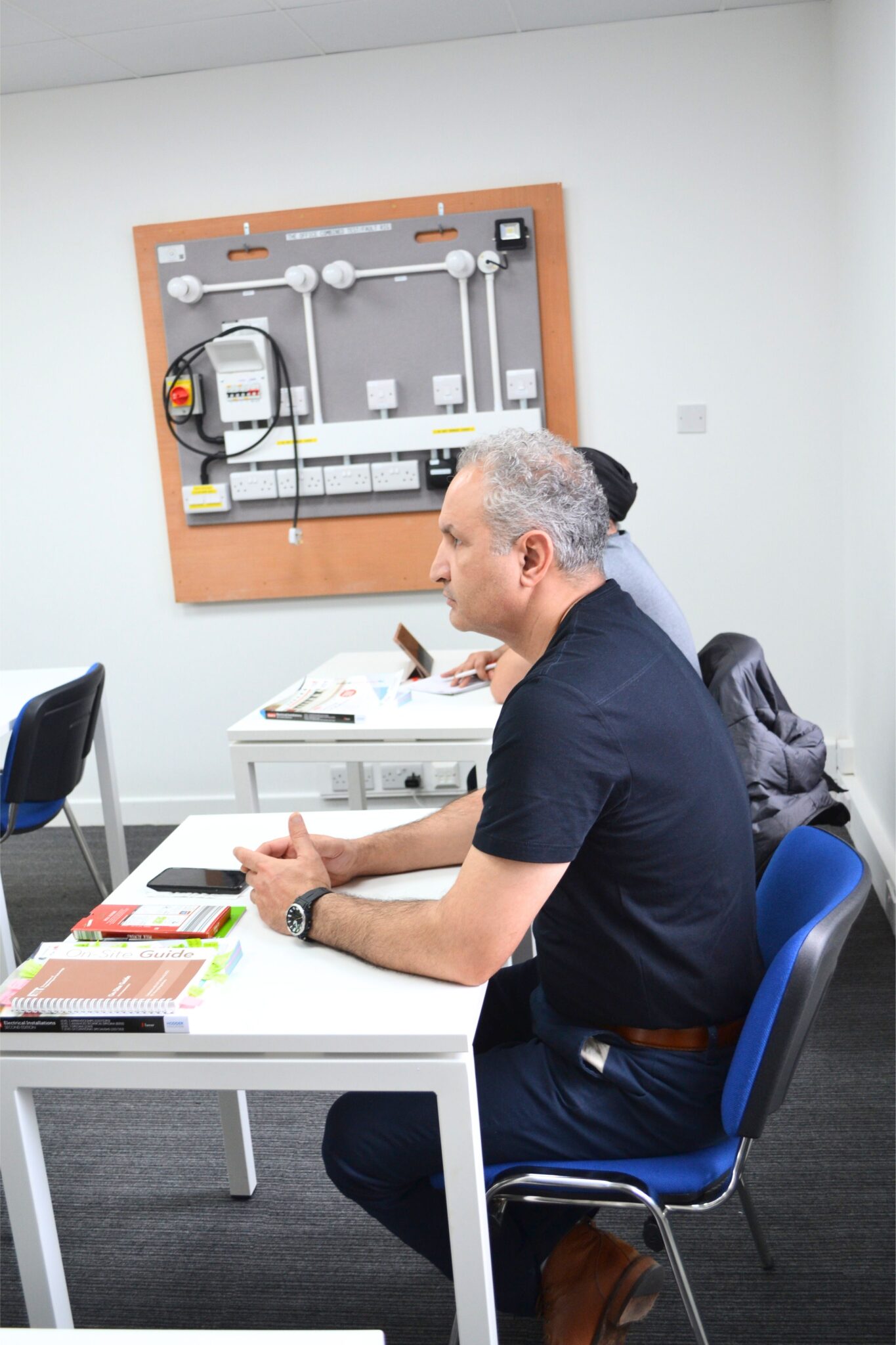 Students learning in a Level 3 Electrical Installation Course classroom at Elec Training