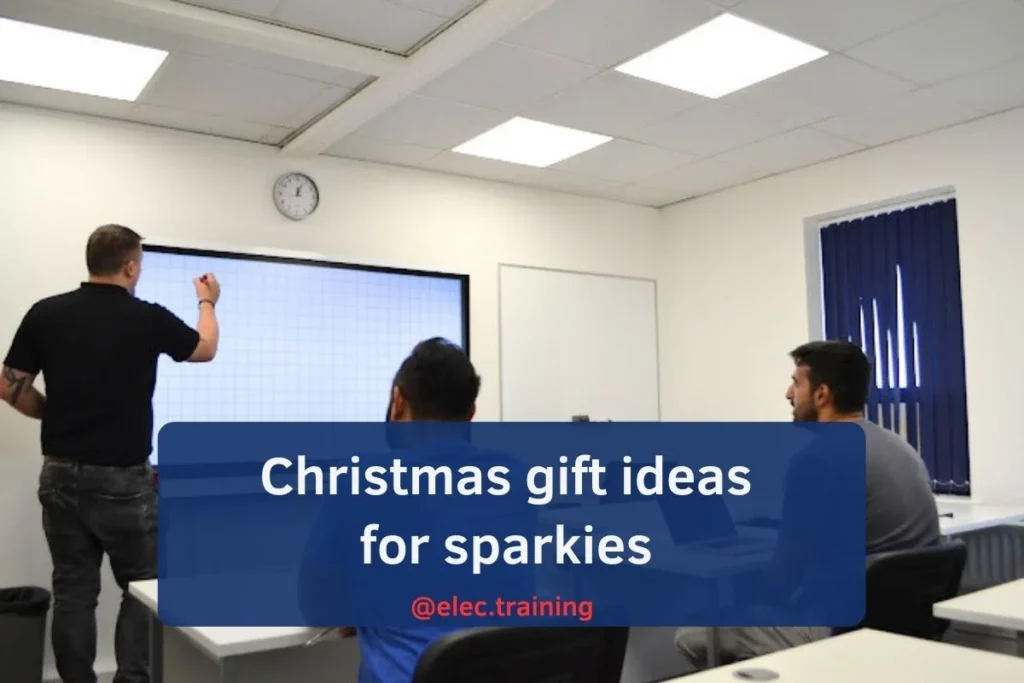 Trainer giving lecture on white board for electrical training