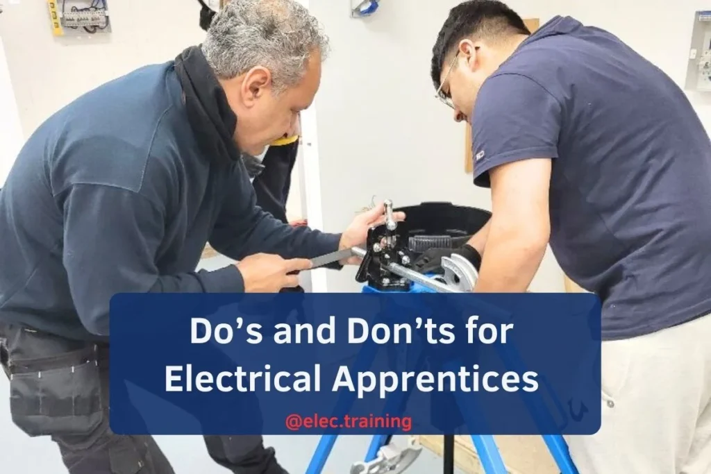 Two Learners engaged in machine work in a workshop, surrounded by tools and machinery.