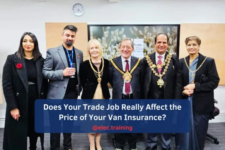 Group photo of officials and guests wearing ceremonial chains at Elec Training