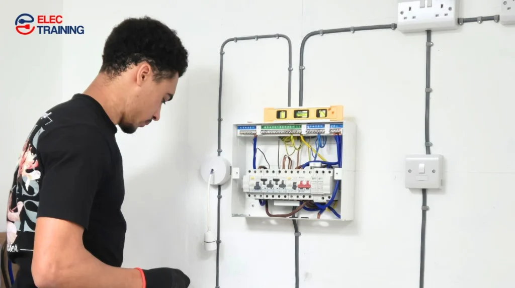 Electrical training practice on a consumer unit during Level 2 electrical training